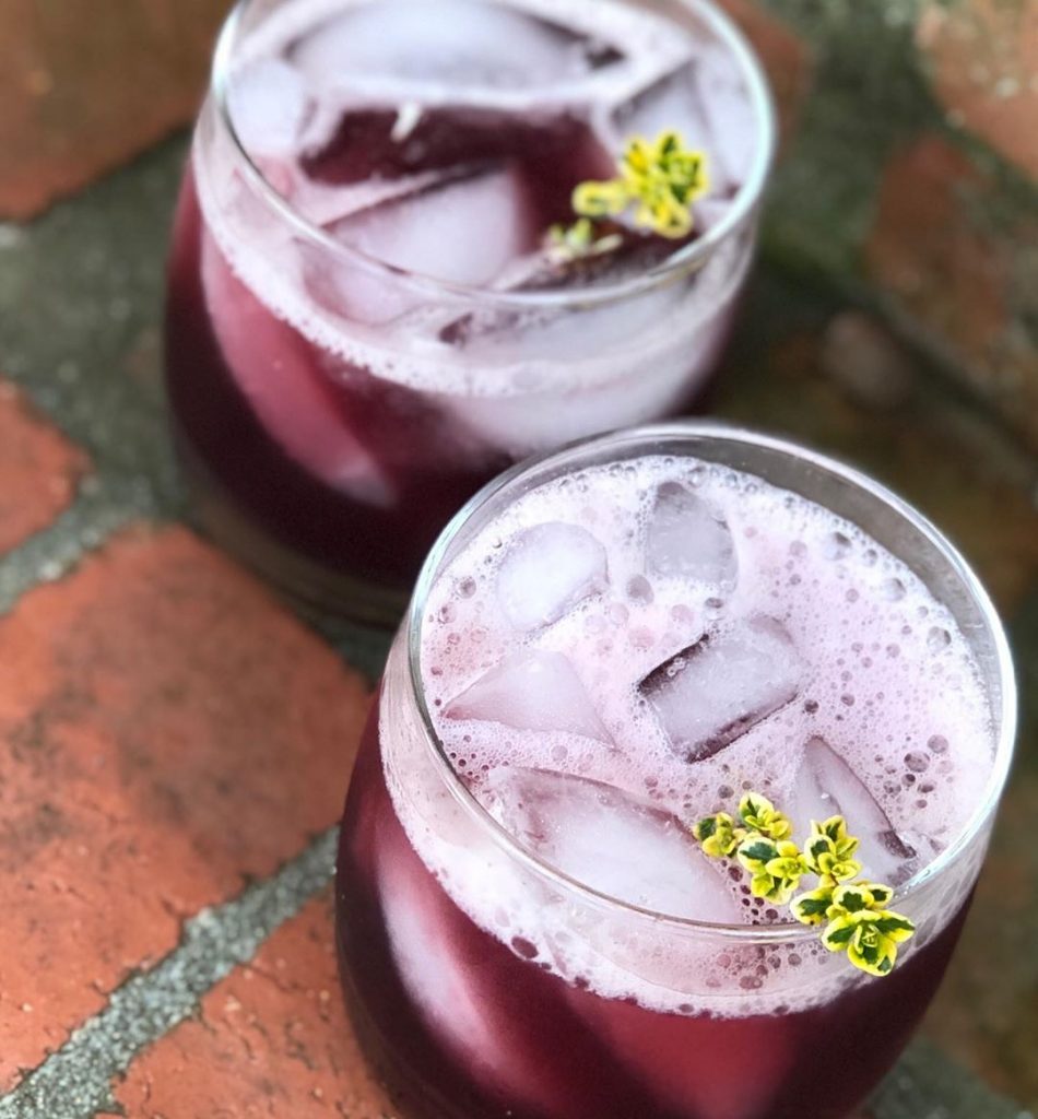 purple cocktail with garnish